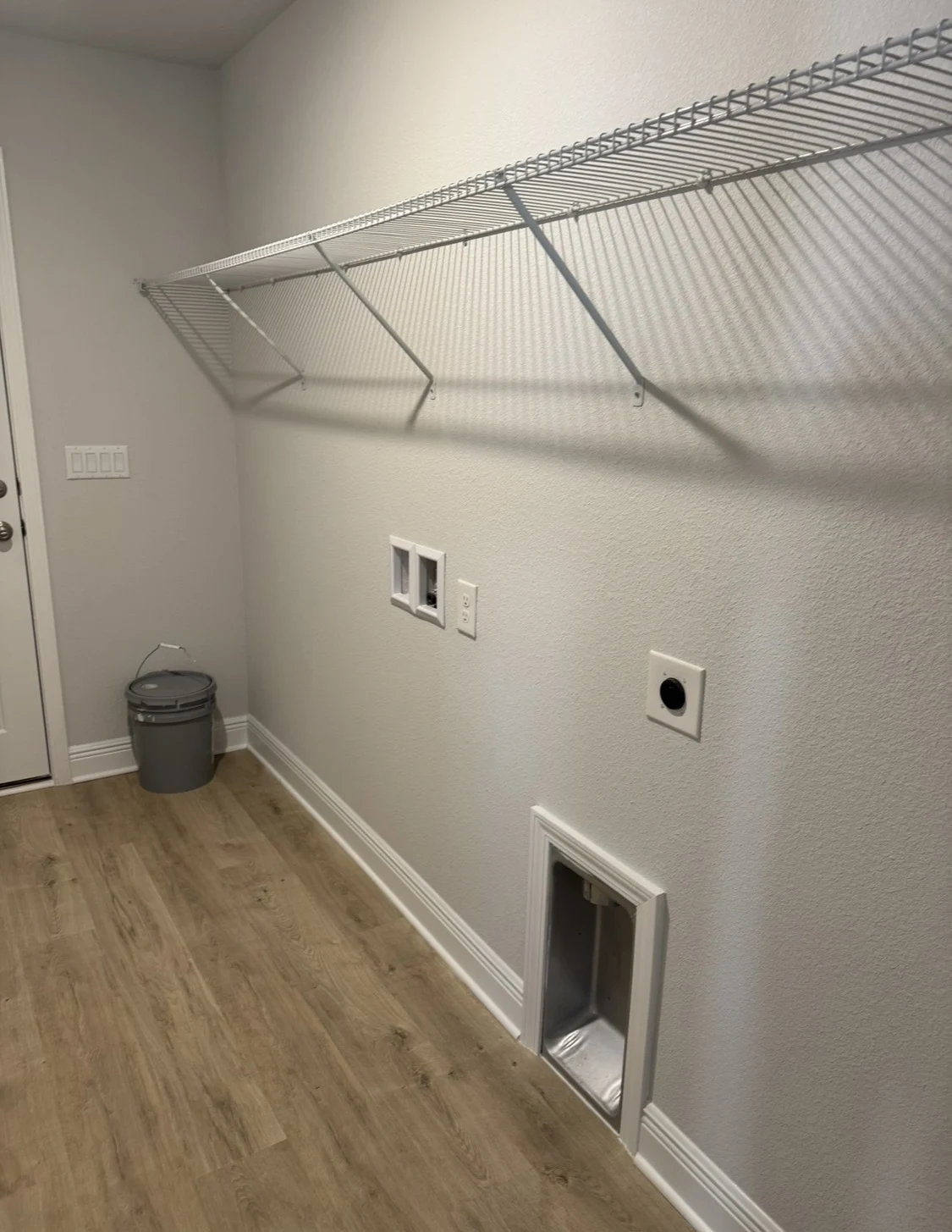 Laundry room before by Joy Signature Designs