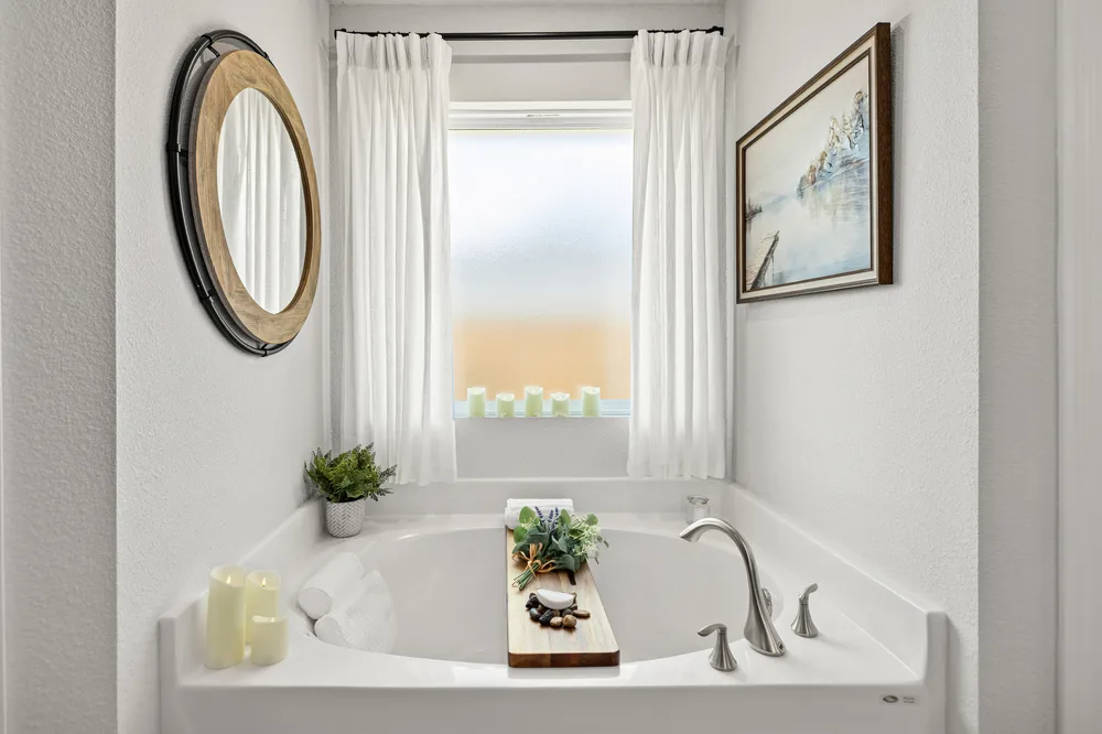 Soaking tub bathroom by Joy Signature Designs