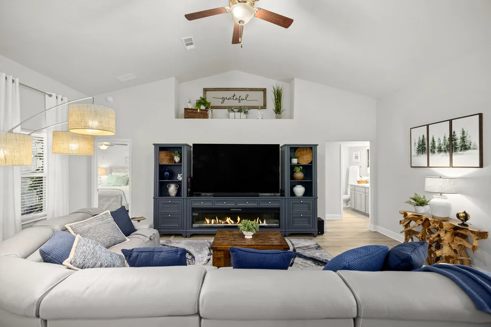 Bold blue living room by Joy Signature Designs