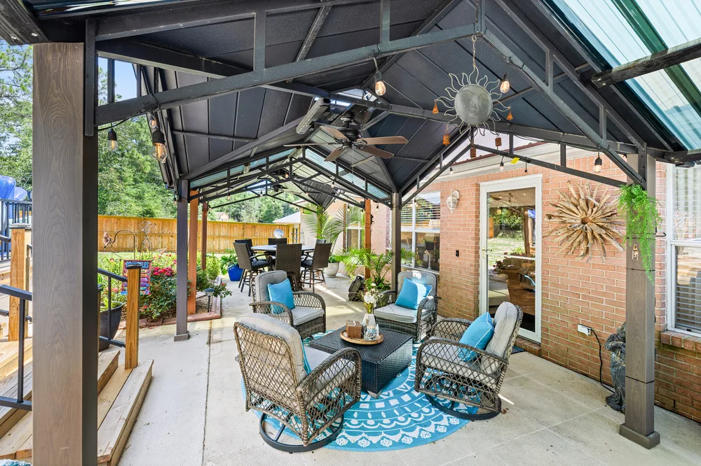 Covered patio design by Joy Signature Designs