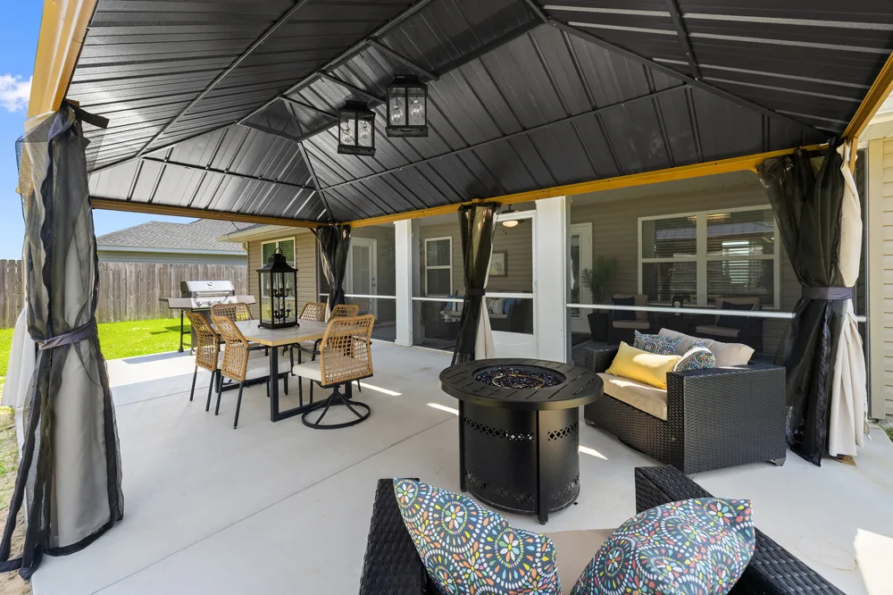 Outdoor entertainment area by Joy Signature Designs